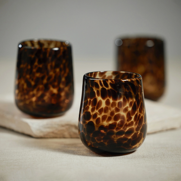 http://www.bluehandhome.com/cdn/shop/products/Stemless-Tortoise-All-Purpose-Glass-Amber-Black-2_600x.png?v=1675719022