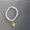 BR201 Pearl Stretch Bracelet with Virgin Mary Medal-Blue Hand Home